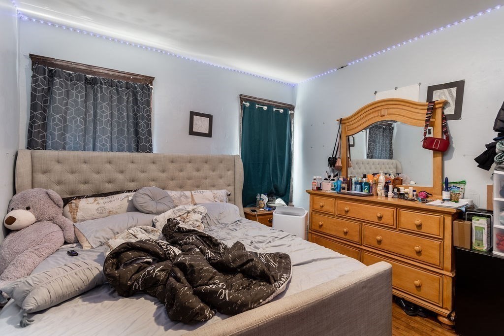 7 Mott Street Worcester, MA 01604 - Photo 10 of 20 a living room with furniture and a fireplace