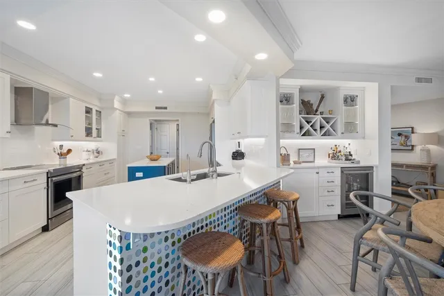 a view of kitchen with cabinets and wooden floor