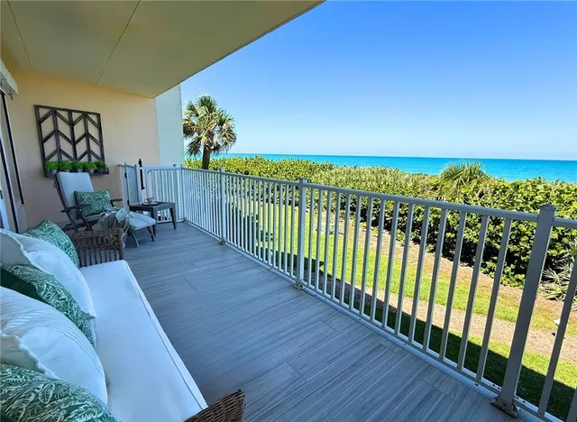 a view of a balcony with chairs