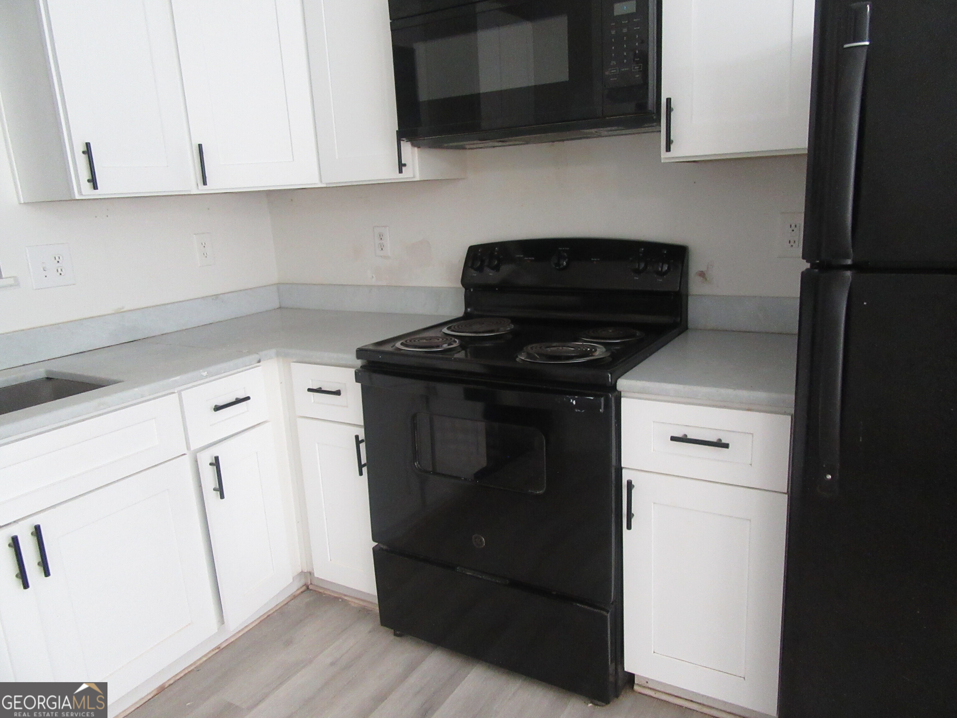 3548 Waldrop Trail Decatur, GA 30034 - Photo 8 of 38 a kitchen with a stove and a microwave