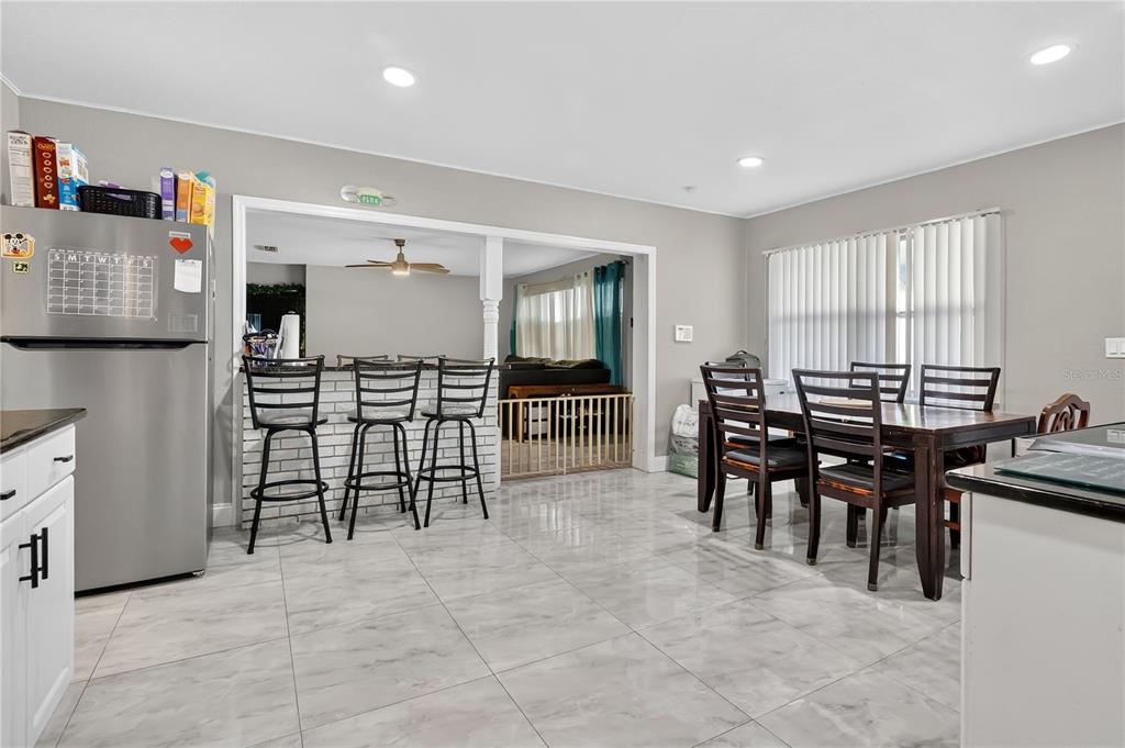 9727 Bear Lake Road Apopka, FL 32703 - Photo 13 of 22 a view of a dining room with furniture