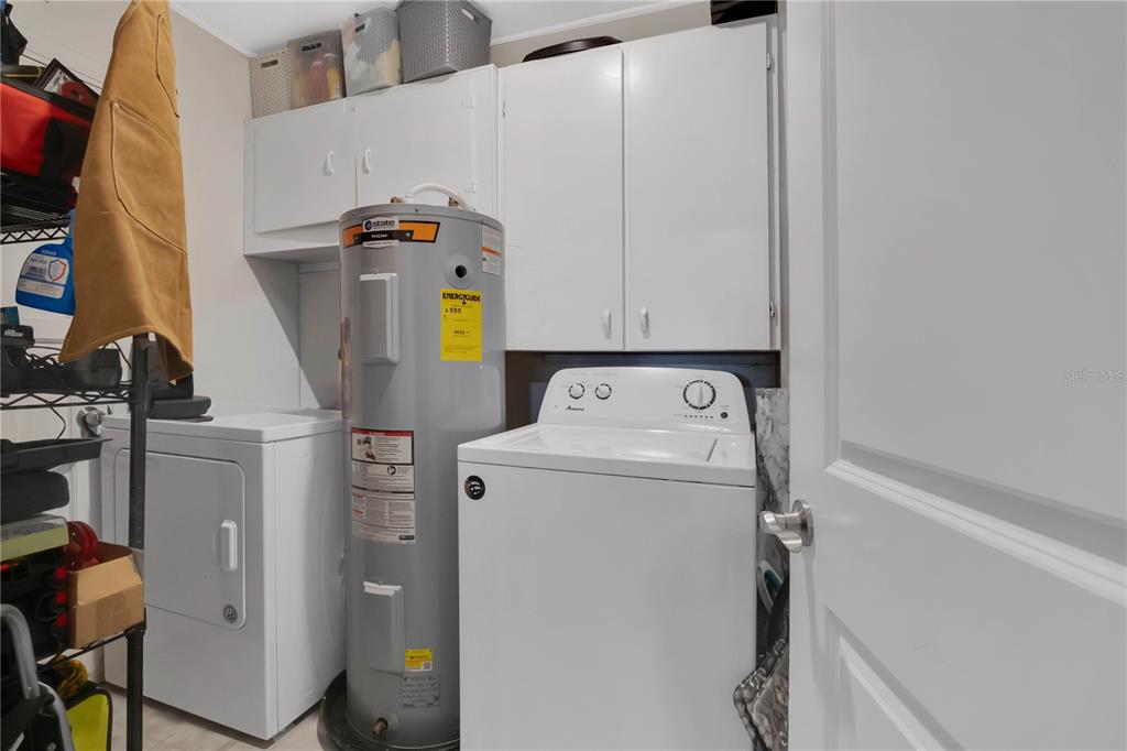 9727 Bear Lake Road Apopka, FL 32703 - Photo 15 of 22 a utility room with dryer and washer