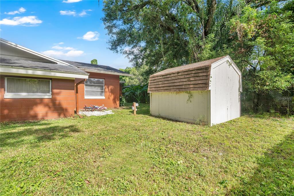 9727 Bear Lake Road Apopka, FL 32703 - Photo 16 of 22 a view of a backyard of the house