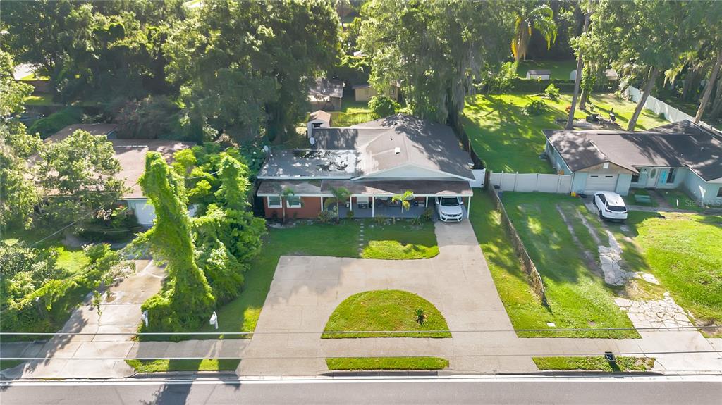 9727 Bear Lake Road Apopka, FL 32703 - Photo 18 of 22 a view of a swimming pool with a patio