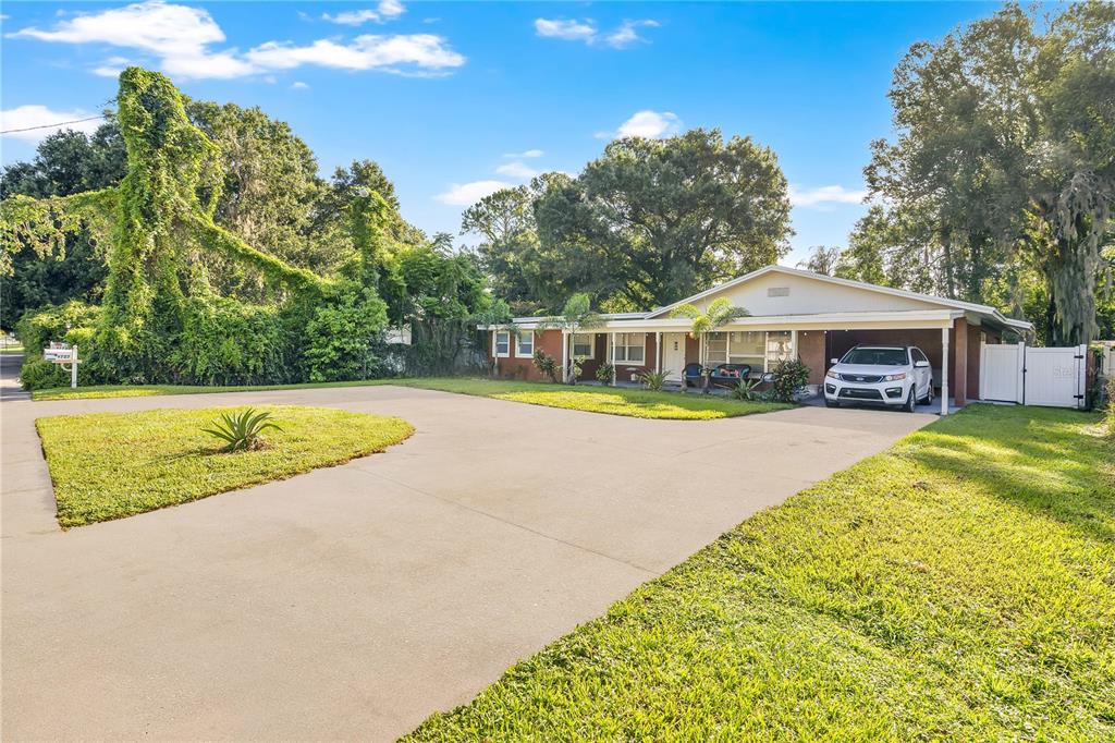 9727 Bear Lake Road Apopka, FL 32703 - Photo 2 of 22 swimming pool with outdoor seating and yard