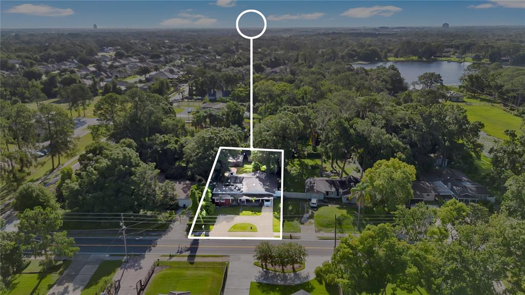9727 Bear Lake Road Apopka, FL 32703 - Photo 21 of 22 a view of a house with a swimming pool