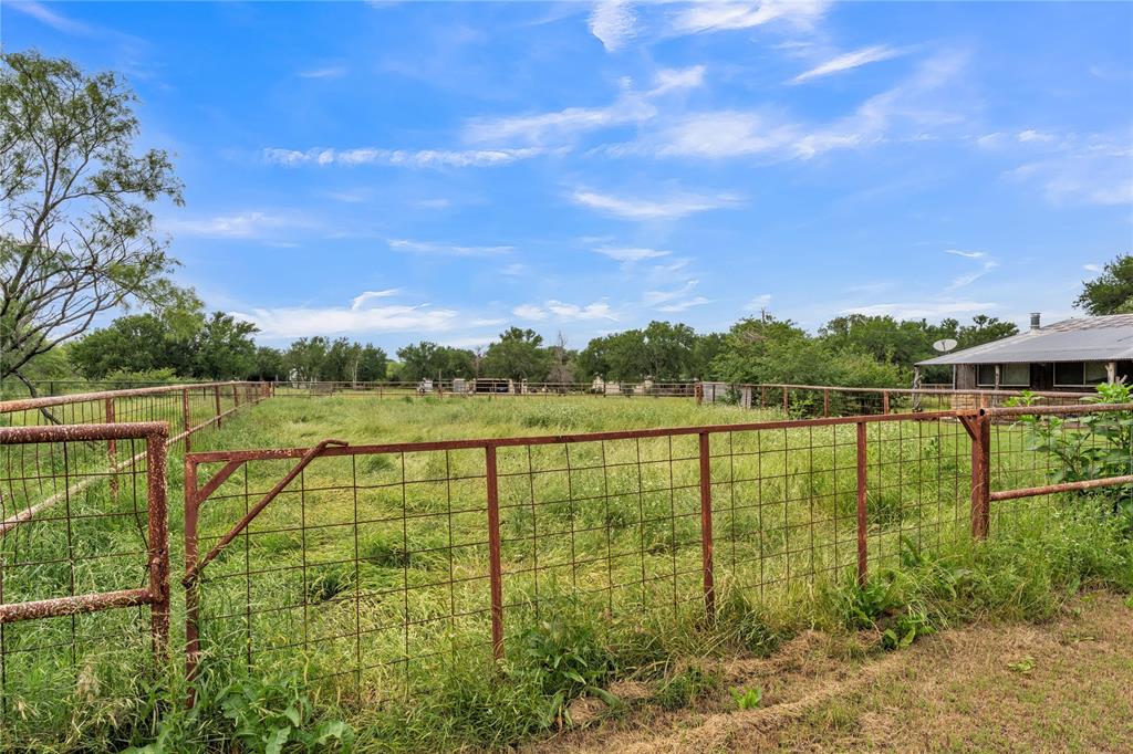 209 Dixie Road Millsap, TX 76066 - Photo 3 of 31 a view of a lake with a big yard
