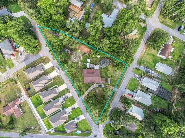 an aerial view of residential houses with outdoor space