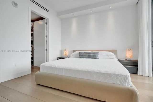 a bathroom with a double vanity sink mirror and shower