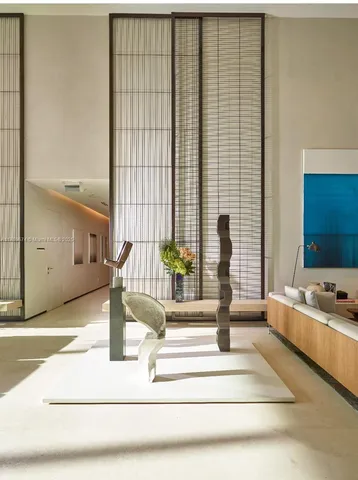 a view of living room kitchen with furniture and window