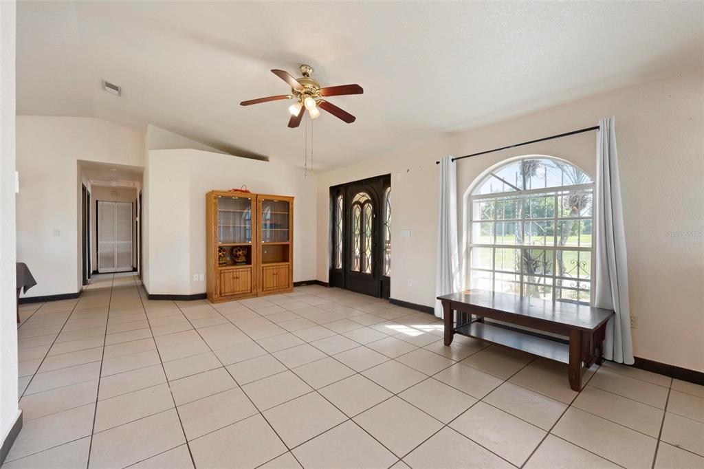 3092 Golfview Drive Wauchula, FL 33873 - Photo 12 of 41 a view of an empty room with window and chandelier fan