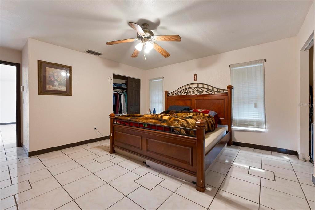 3092 Golfview Drive Wauchula, FL 33873 - Photo 24 of 41 a bed room with a bed and a chandelier
