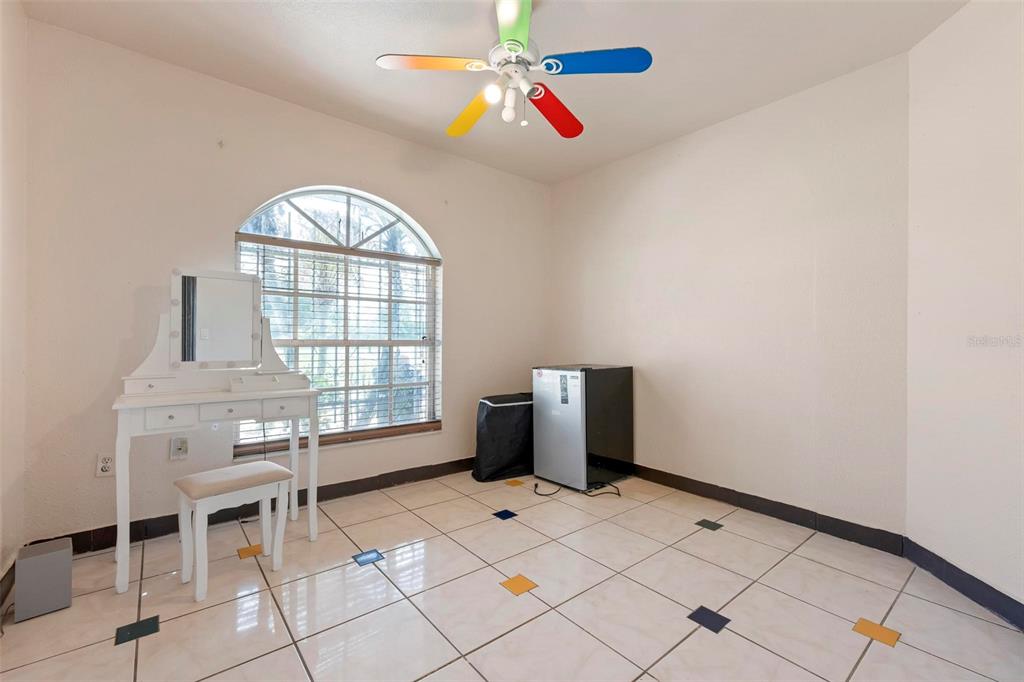 3092 Golfview Drive Wauchula, FL 33873 - Photo 27 of 41 a view of an empty room with window and chandelier fan