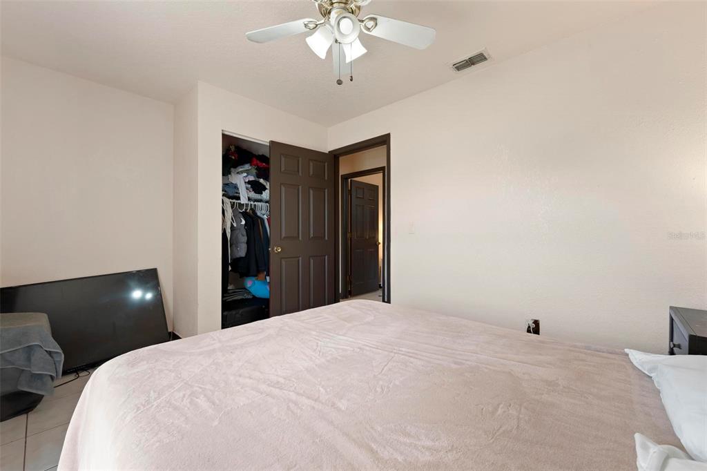 3092 Golfview Drive Wauchula, FL 33873 - Photo 30 of 41 a bedroom with a bed and a chandelier
