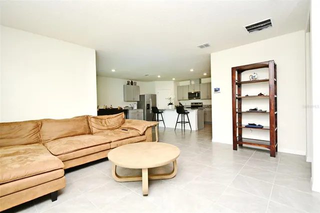 a living room with furniture and a table