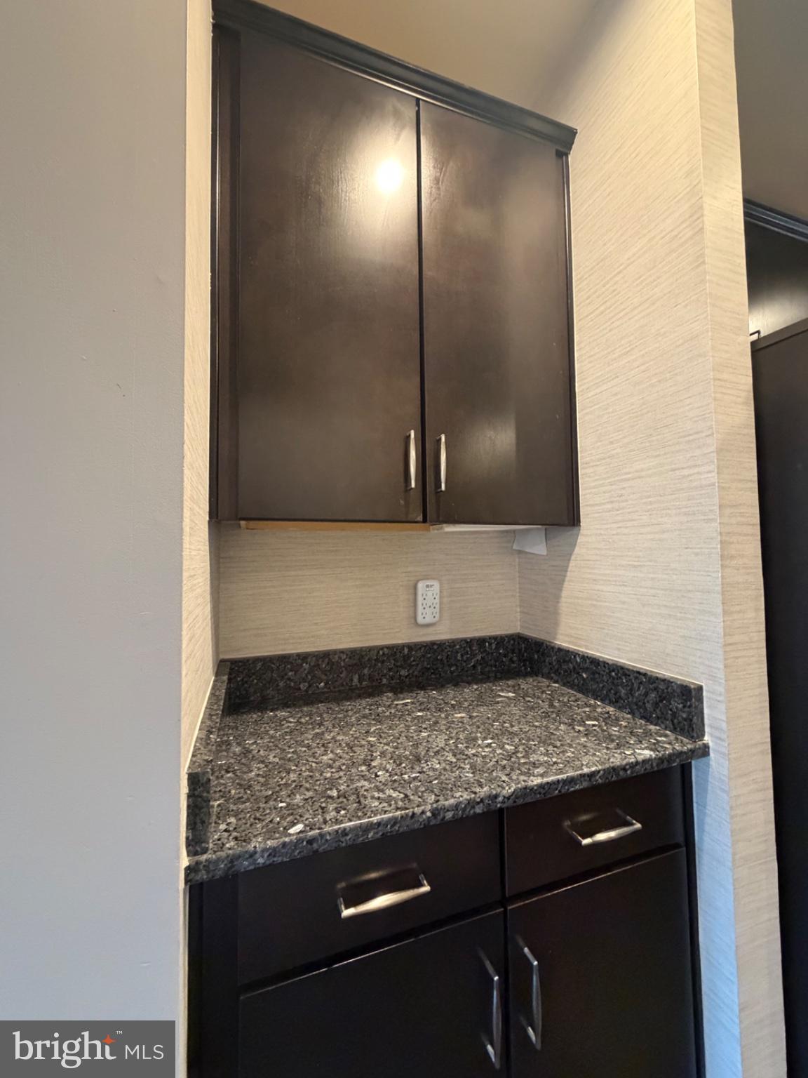 25333 Wakestone Terrace Chantilly, VA 20152 - Photo 36 of 109 Sleek cabinetry with granite accents.