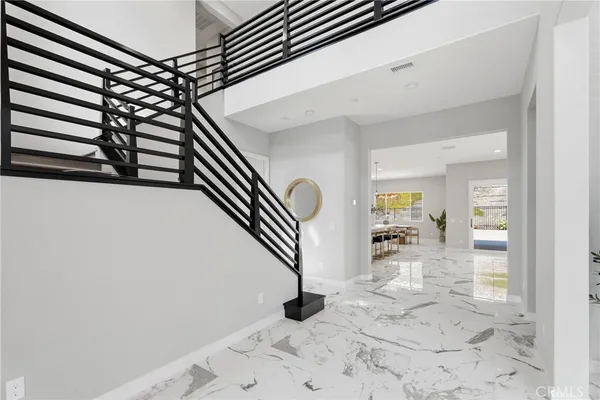 a kitchen with stainless steel appliances kitchen island granite countertop a sink a counter top space and cabinets