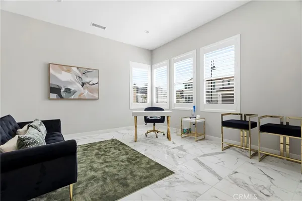 a living room with furniture and window