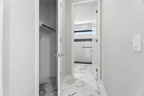 a kitchen with stainless steel appliances kitchen island granite countertop a table and chairs in it