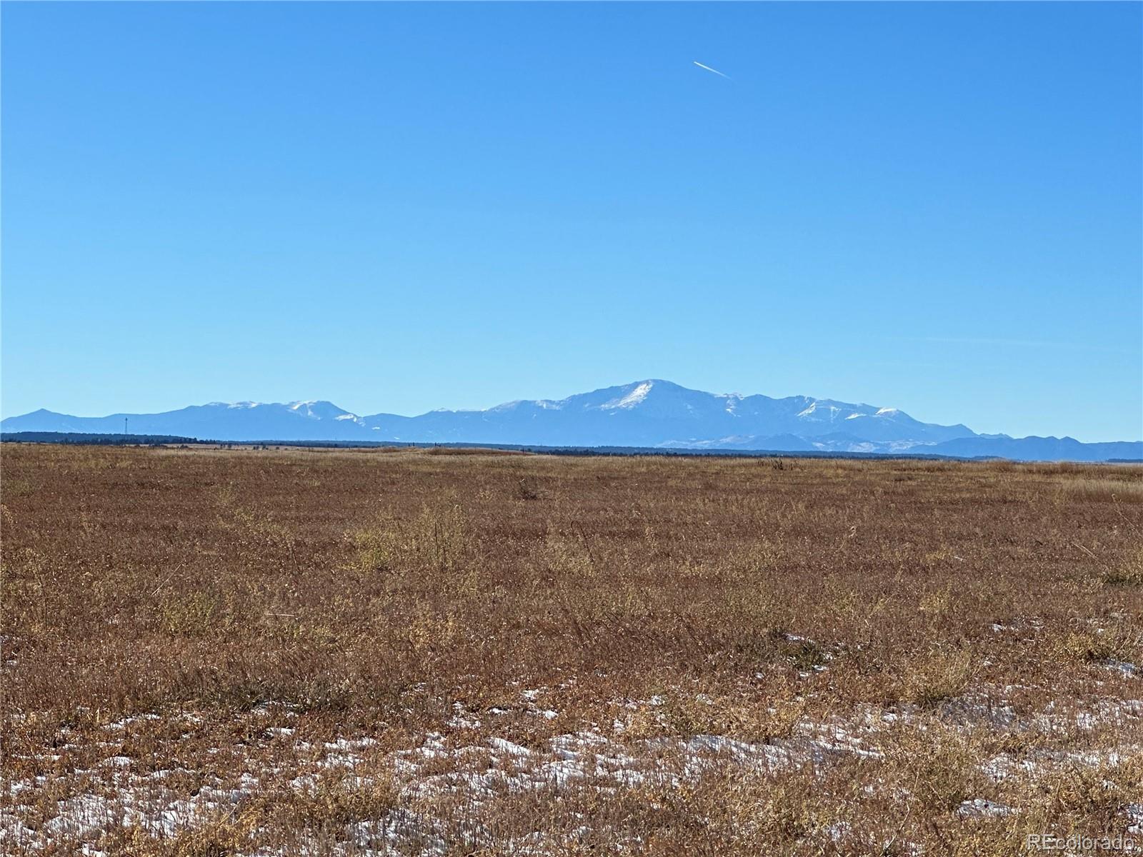 a view of an ocean and mountain