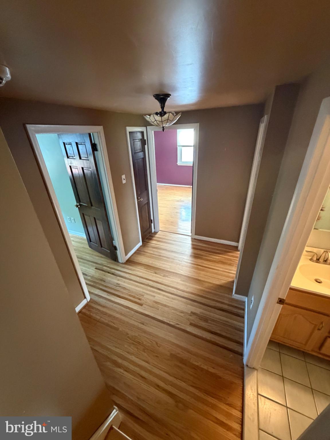 803 Rennard Circle Philadelphia, PA 19116 - Photo 27 of 42 Inviting hallway with warm wood floors.