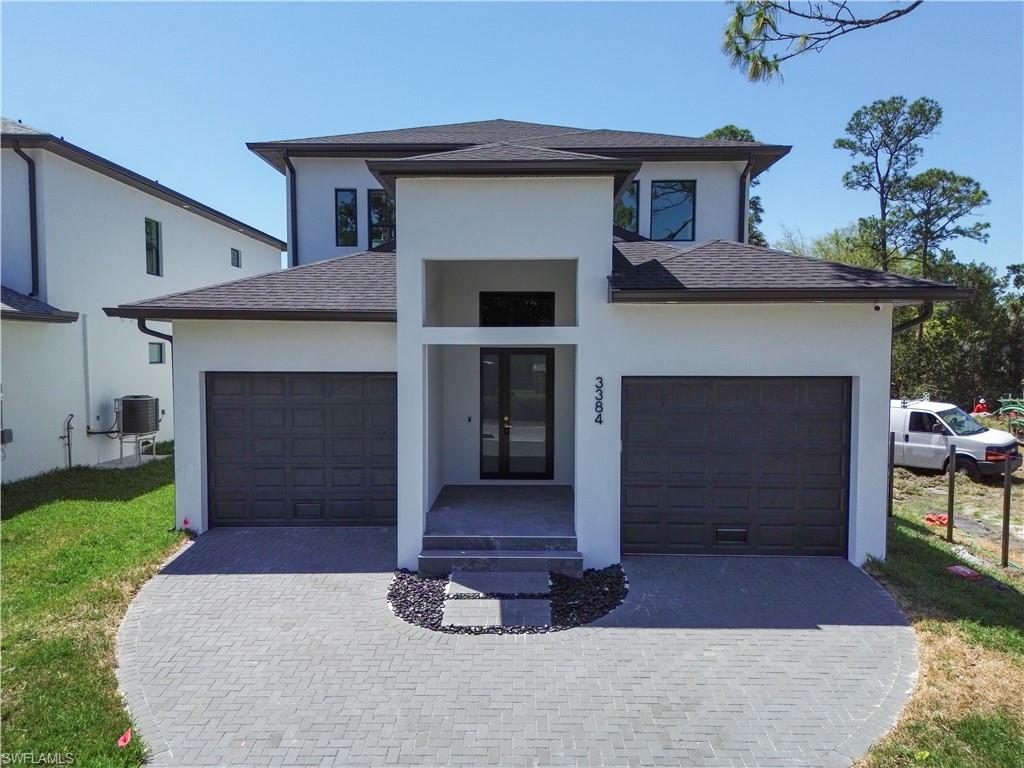 3384 Canal Street Naples, FL 34112 - Photo 34 of 34 a front view of a house with garden