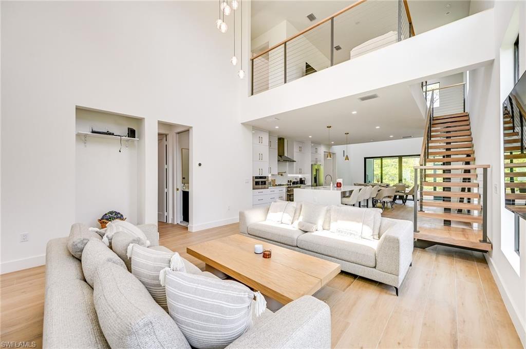 3384 Canal Street Naples, FL 34112 - Photo 5 of 34 a living room with furniture and a large window