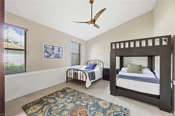 a bedroom with a bed and a table