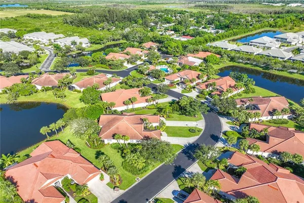 an aerial view of a houses and an outdoor space