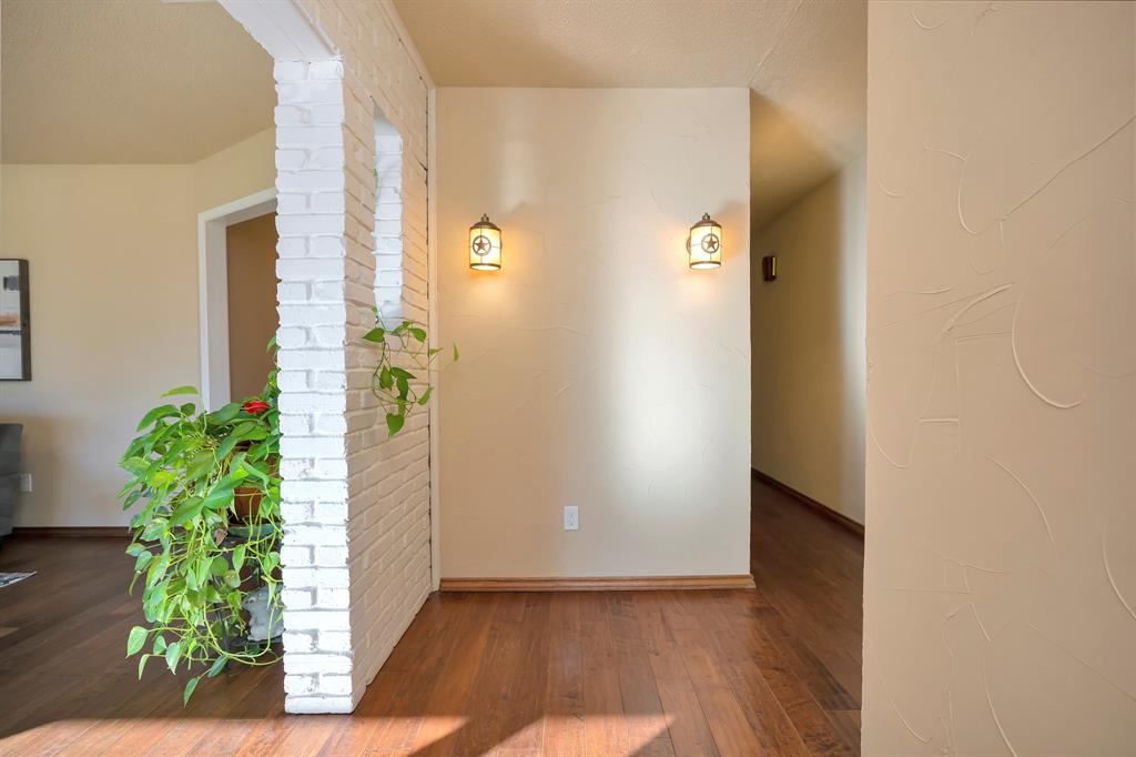 1761 Cynthia Lane Hurst, TX 76054 - Photo 11 of 40 an entryway with wooden floor