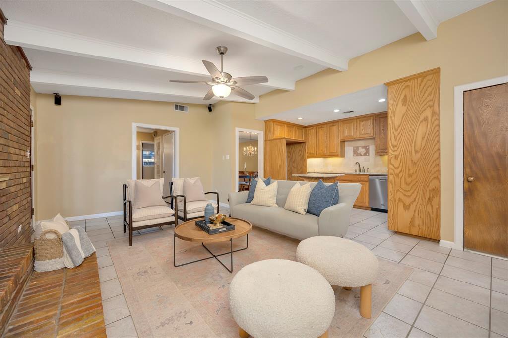 1761 Cynthia Lane Hurst, TX 76054 - Photo 13 of 40 a living room with furniture and a chandelier