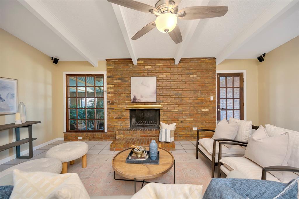 1761 Cynthia Lane Hurst, TX 76054 - Photo 14 of 40 a living room with fireplace furniture and a wooden floor