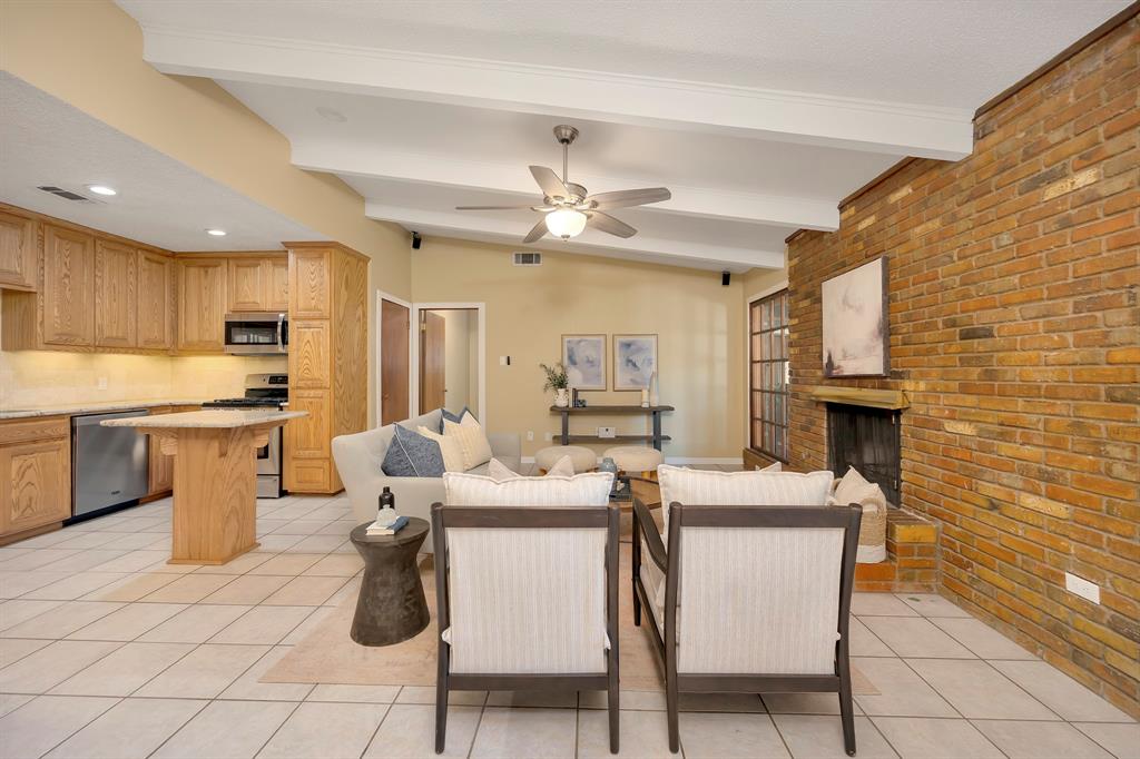 1761 Cynthia Lane Hurst, TX 76054 - Photo 17 of 40 a dining room with furniture a window and kitchen view
