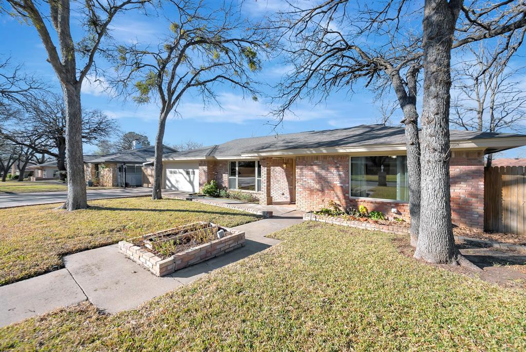 1761 Cynthia Lane Hurst, TX 76054 - Photo 2 of 40 a view of a house with backyard sitting area and tub