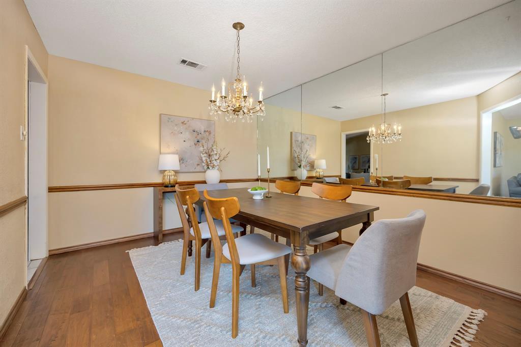 1761 Cynthia Lane Hurst, TX 76054 - Photo 22 of 40 a dining table with chairs and view of kitchen