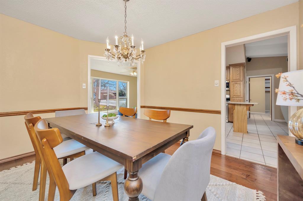 1761 Cynthia Lane Hurst, TX 76054 - Photo 23 of 40 a view of a dining room with furniture and window