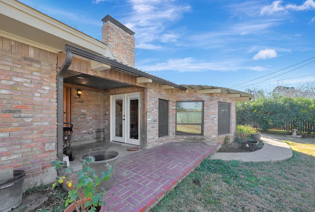1761 Cynthia Lane Hurst, TX 76054 - Photo 40 of 40 a front view of a house with garden