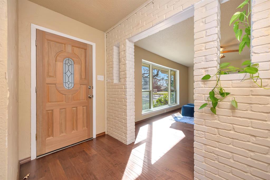 1761 Cynthia Lane Hurst, TX 76054 - Photo 10 of 40 a living room with furniture and large windows