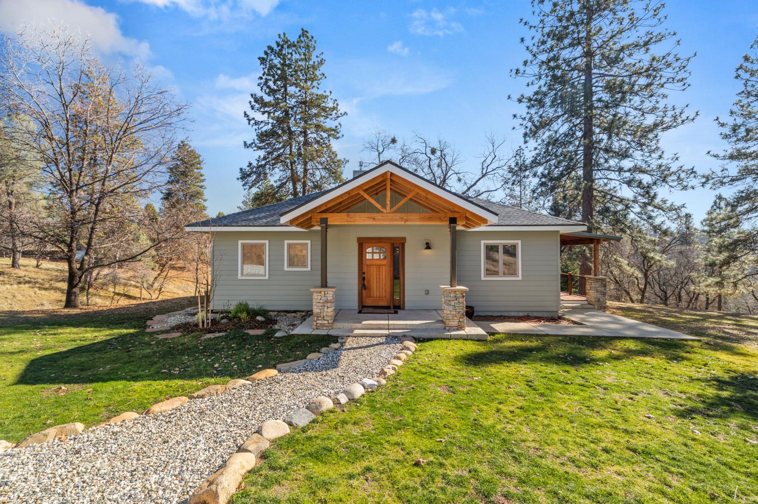 a front view of house with yard outdoor seating and green space