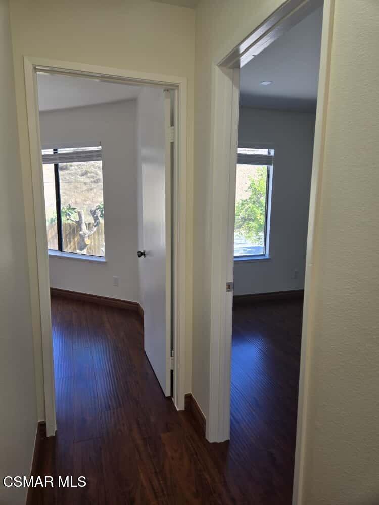 6492 Melray Street Moorpark, CA 93021 - Photo 24 of 59 a view of an empty room with wooden floor and a window