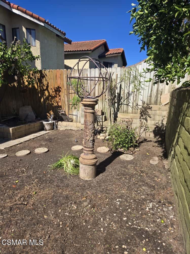 6492 Melray Street Moorpark, CA 93021 - Photo 29 of 59 a view of a patio with table and chairs and potted plants