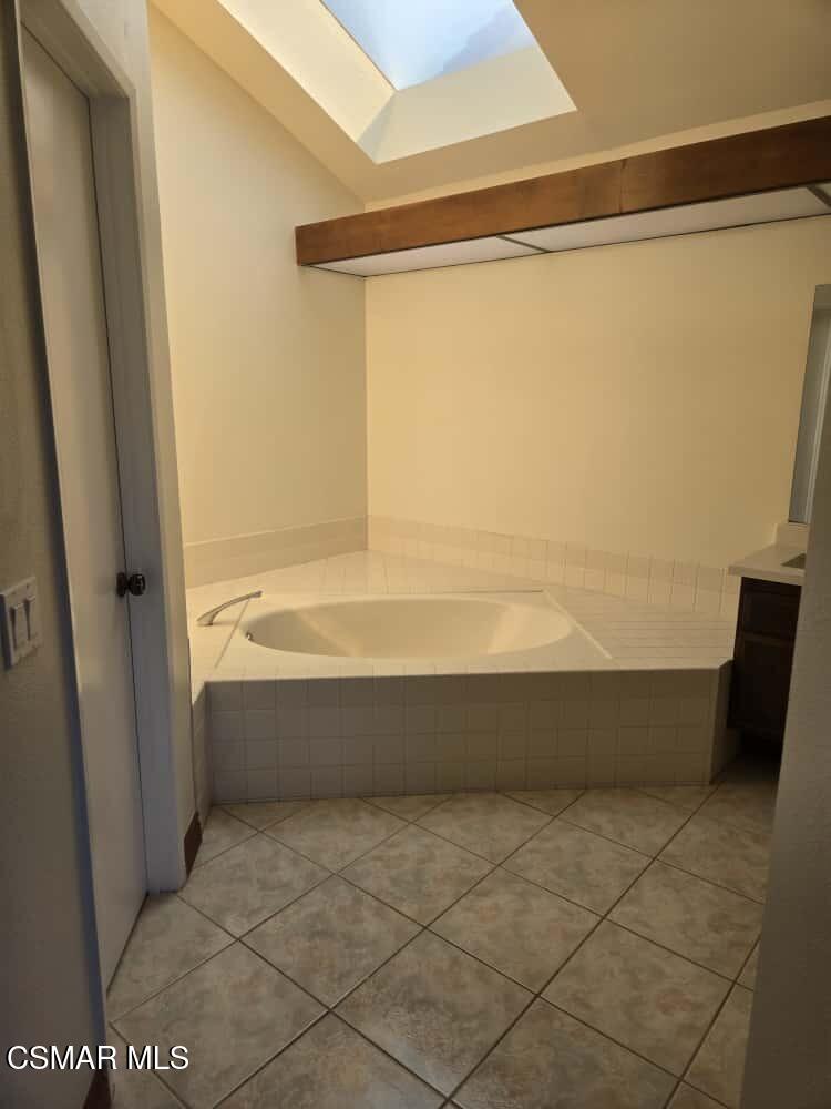 6492 Melray Street Moorpark, CA 93021 - Photo 9 of 59 a bathroom with a bathtub and a shower