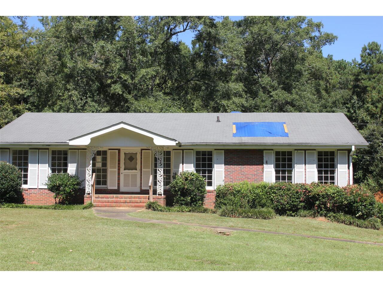1500 Fairmont Road Sylacauga, AL 35150 - Photo 1 of 1 a front view of a house with a yard