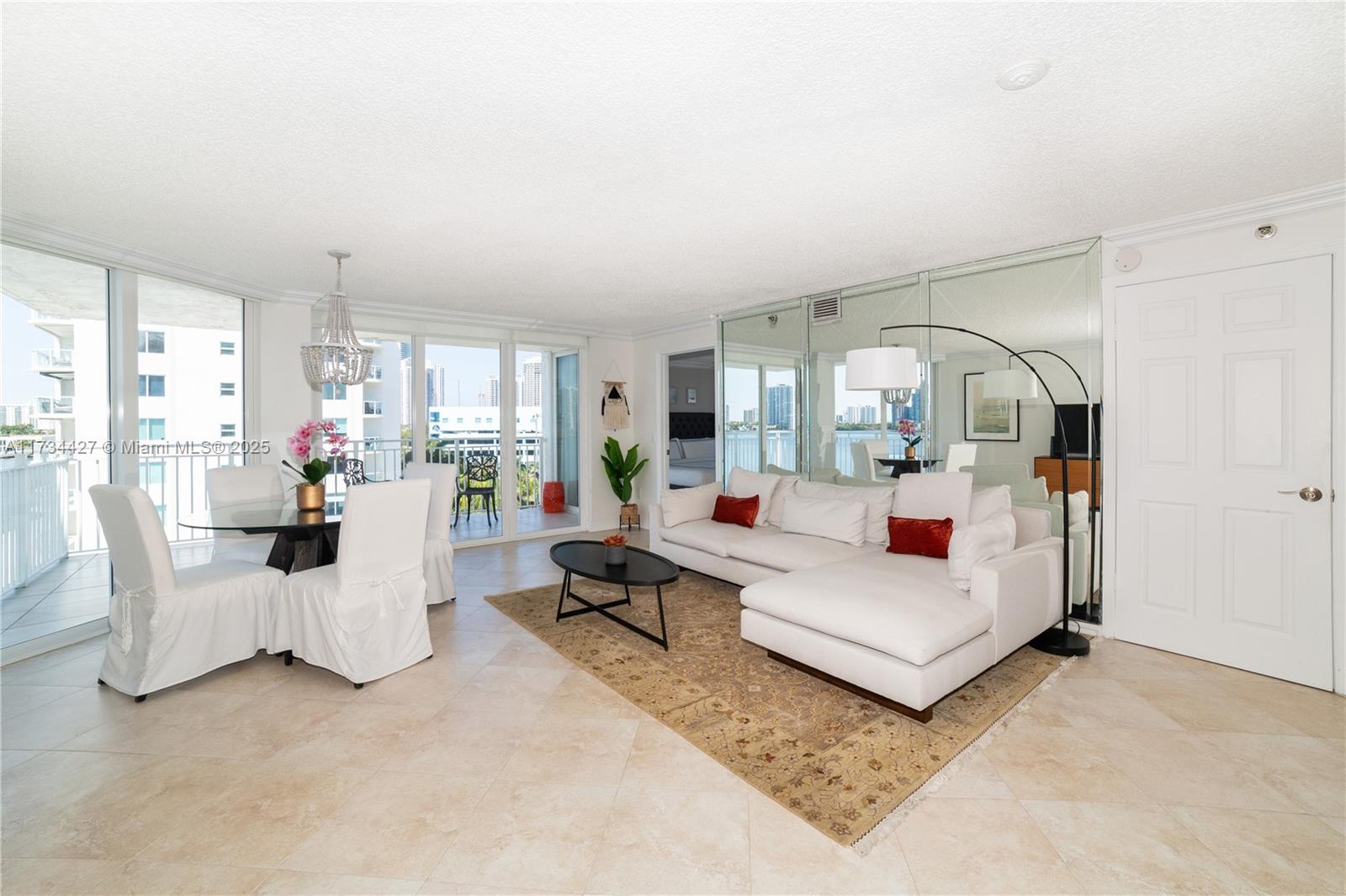 a living room with furniture white walls and white walls