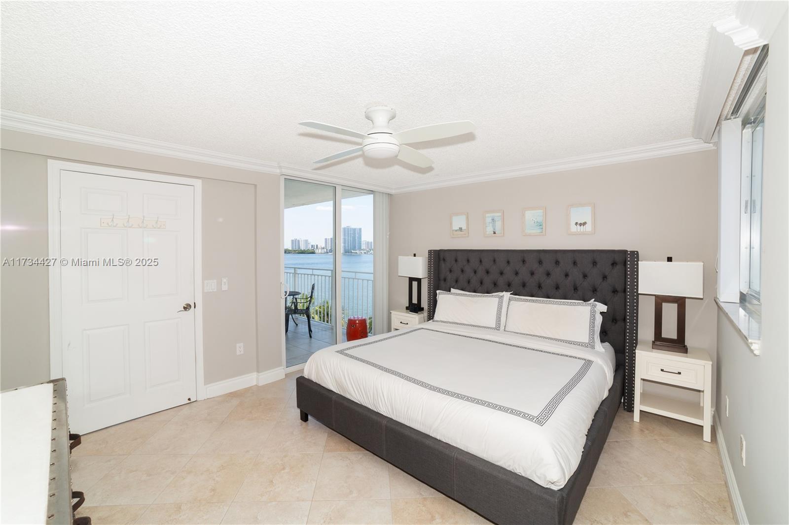 18000 North Bay Road, Unit 602 Sunny Isles Beach, FL 33160 - Photo 11 of 40 a large white bed in a white room