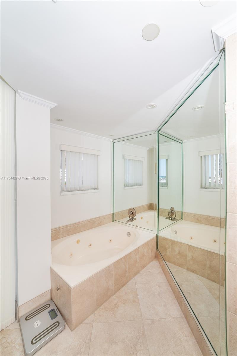 18000 North Bay Road, Unit 602 Sunny Isles Beach, FL 33160 - Photo 15 of 40 a bathroom with a bathtub and a sink