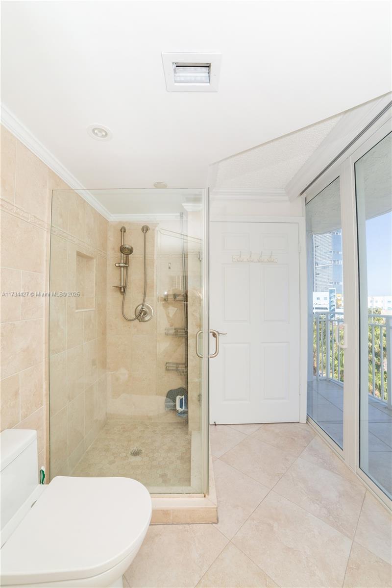 18000 North Bay Road, Unit 602 Sunny Isles Beach, FL 33160 - Photo 16 of 40 a bathroom with a shower and toilet