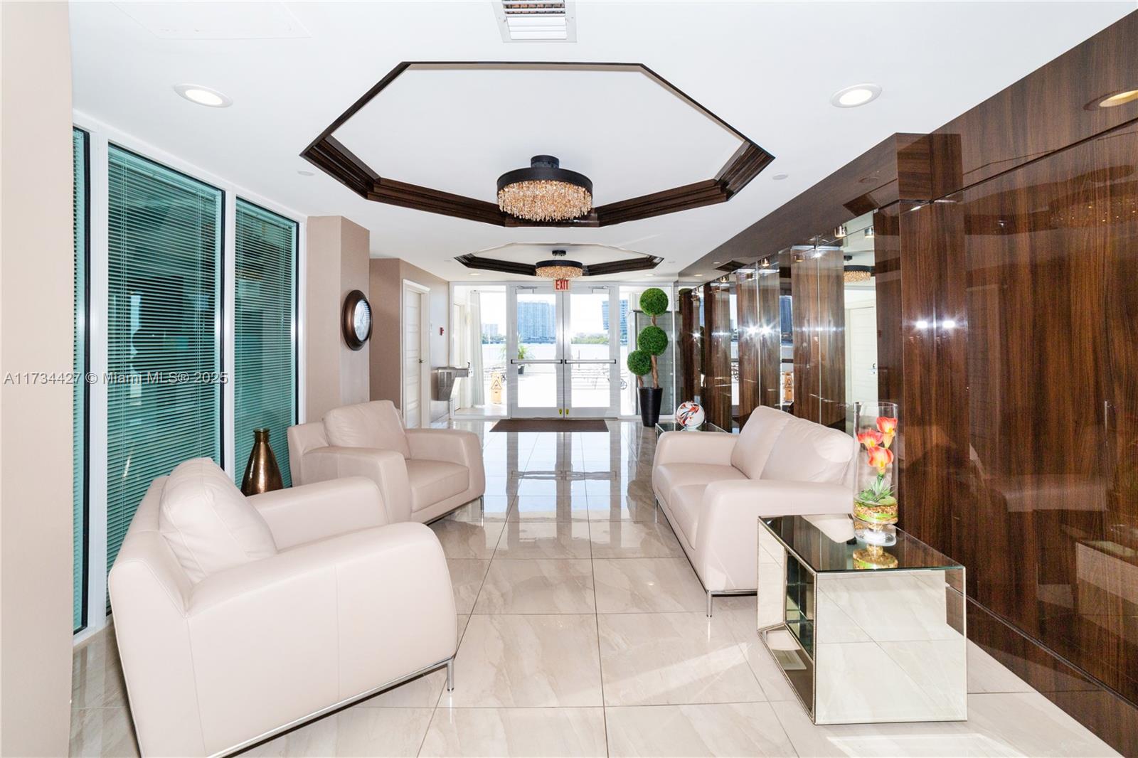 18000 North Bay Road, Unit 602 Sunny Isles Beach, FL 33160 - Photo 27 of 40 a living room with furniture and wooden floor