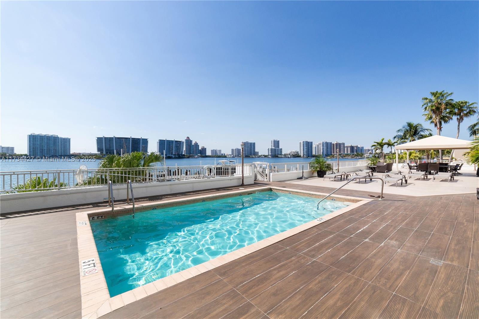 18000 North Bay Road, Unit 602 Sunny Isles Beach, FL 33160 - Photo 31 of 40 a view of a swimming pool and a patio