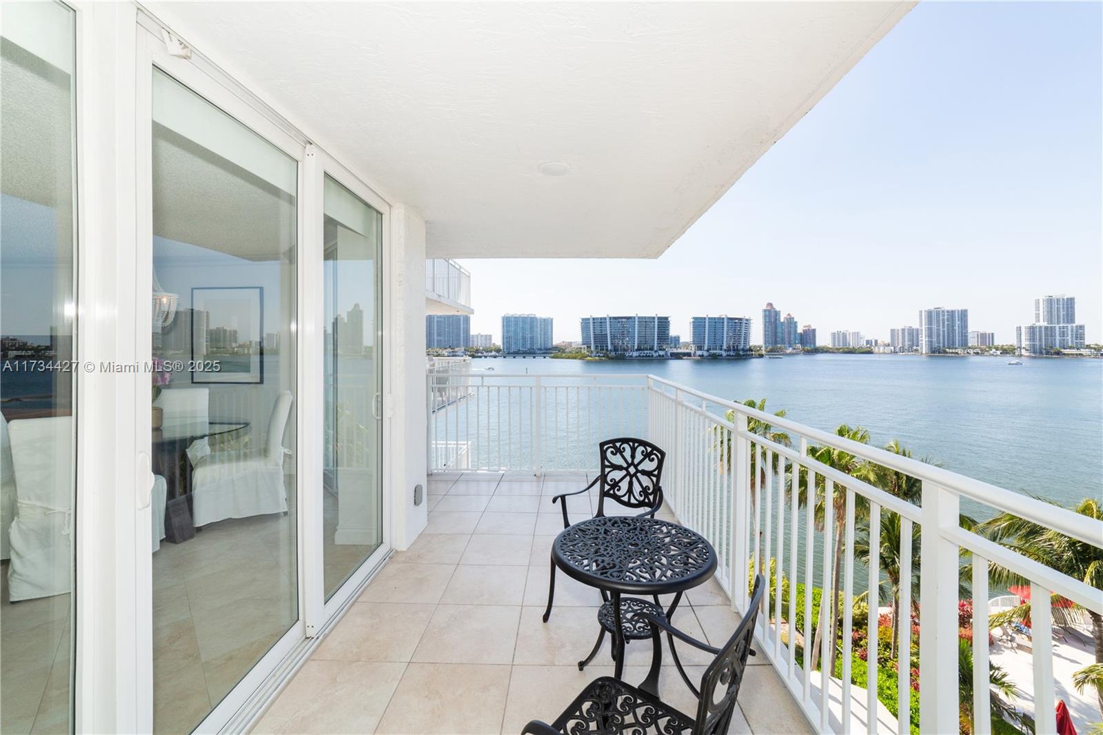 18000 North Bay Road, Unit 602 Sunny Isles Beach, FL 33160 - Photo 7 of 40 a balcony with an outdoor seating